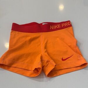 Nike Pro Orange Athletic Shorts with Red Waistband